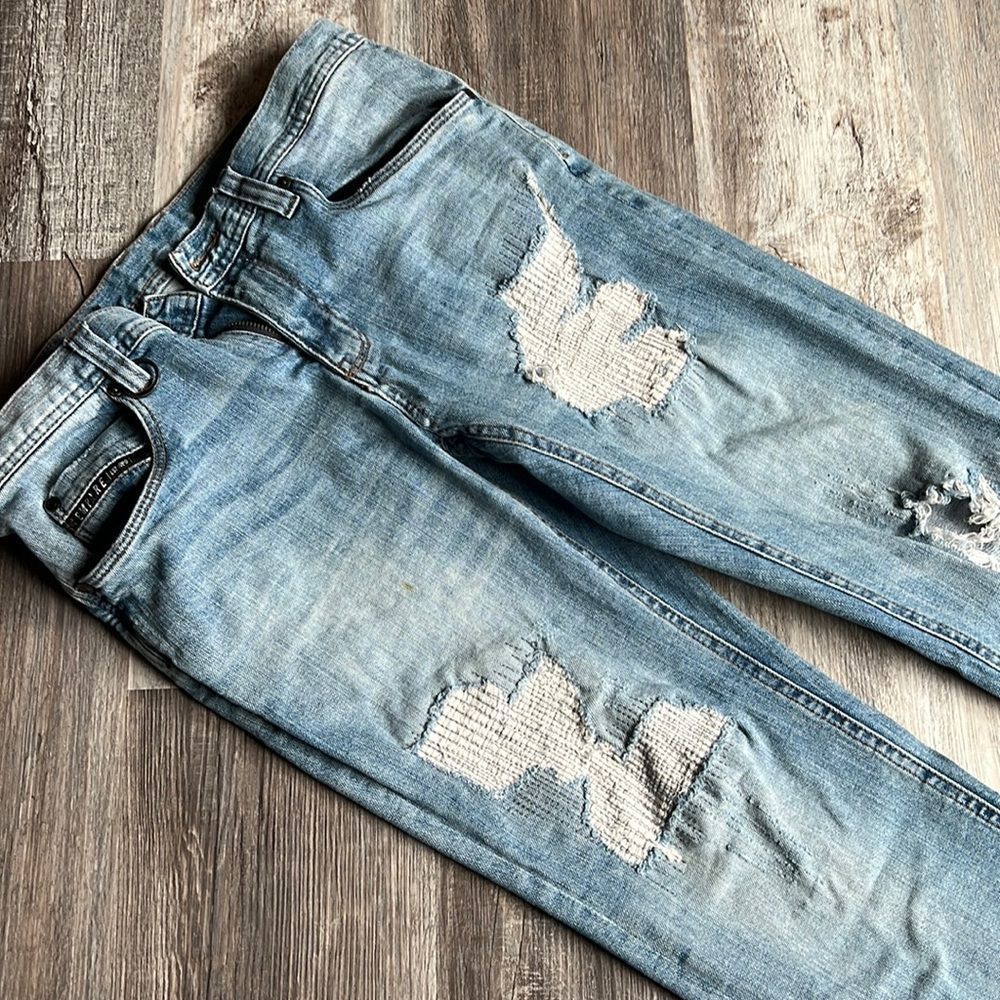 Men’s jeans with rips and tears